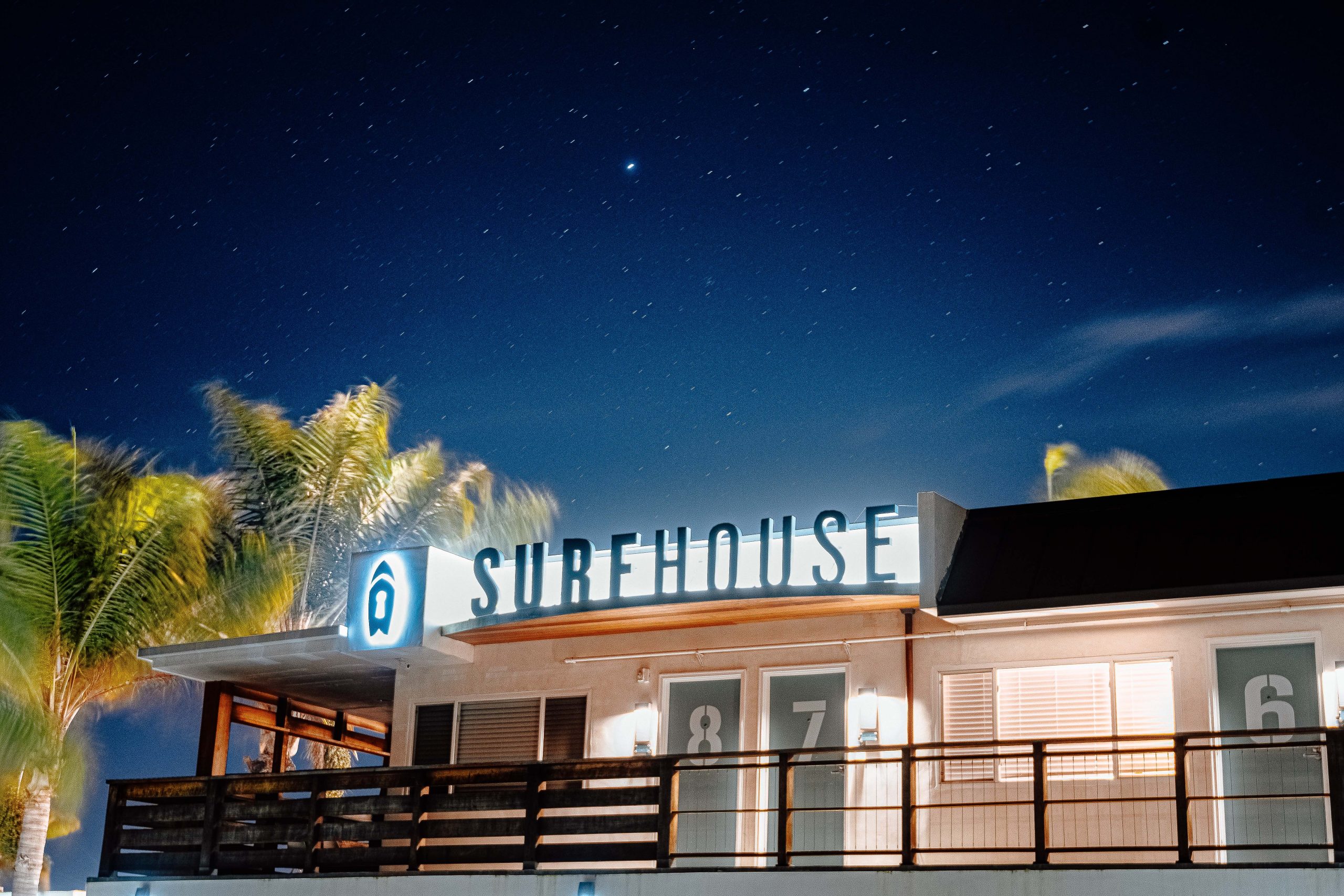 a photo of the exterior of surfhouse at night